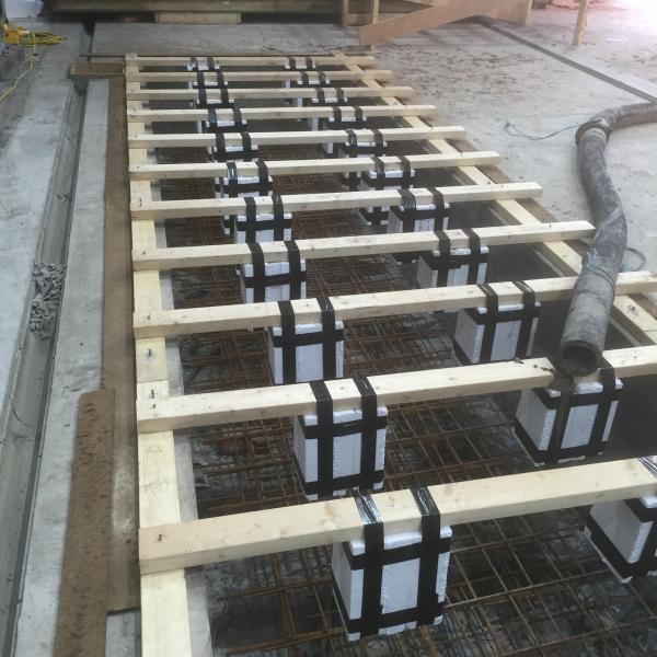 150mm steel cased mini piles and reinforcement cage in position for new machine base