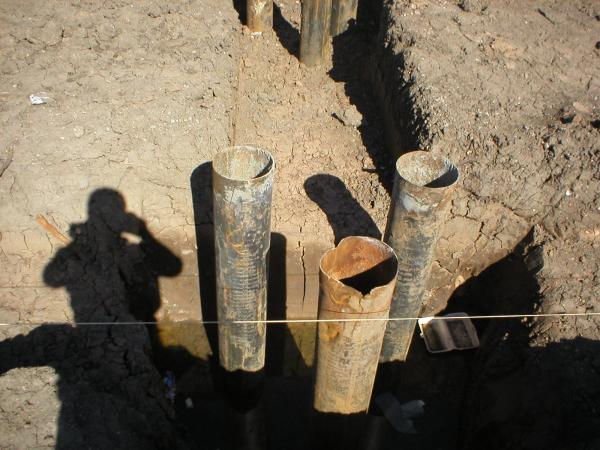 150mm steel cased Mini Piles to support new pile caps to structural frame