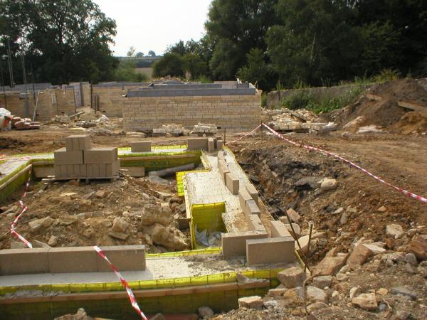 Completed piled ground beam with Pecafil Formwork at start of bricklaying process